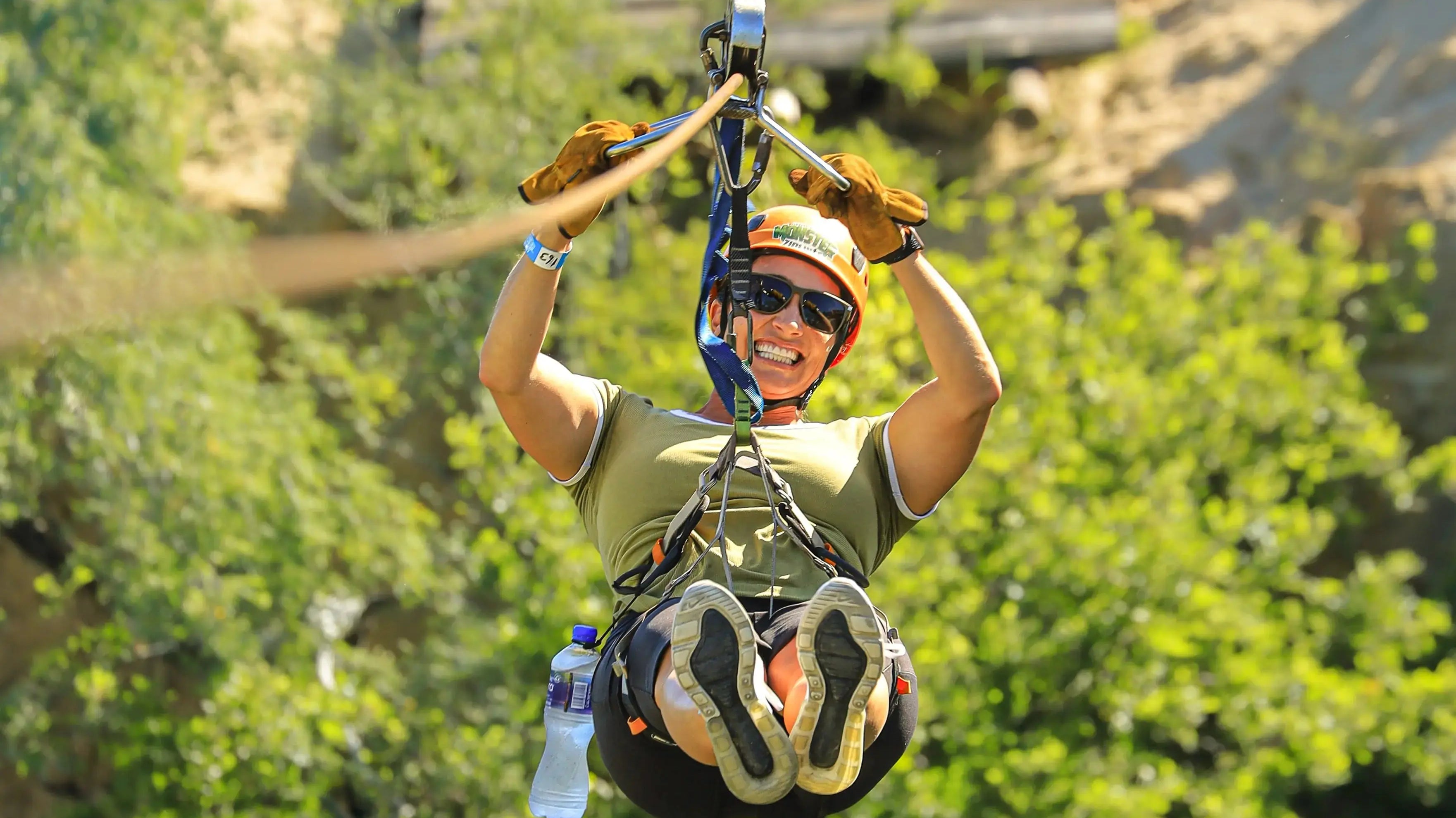 Guests ziplining over the canyon at Wild Canyon Adventures in Los Cabos