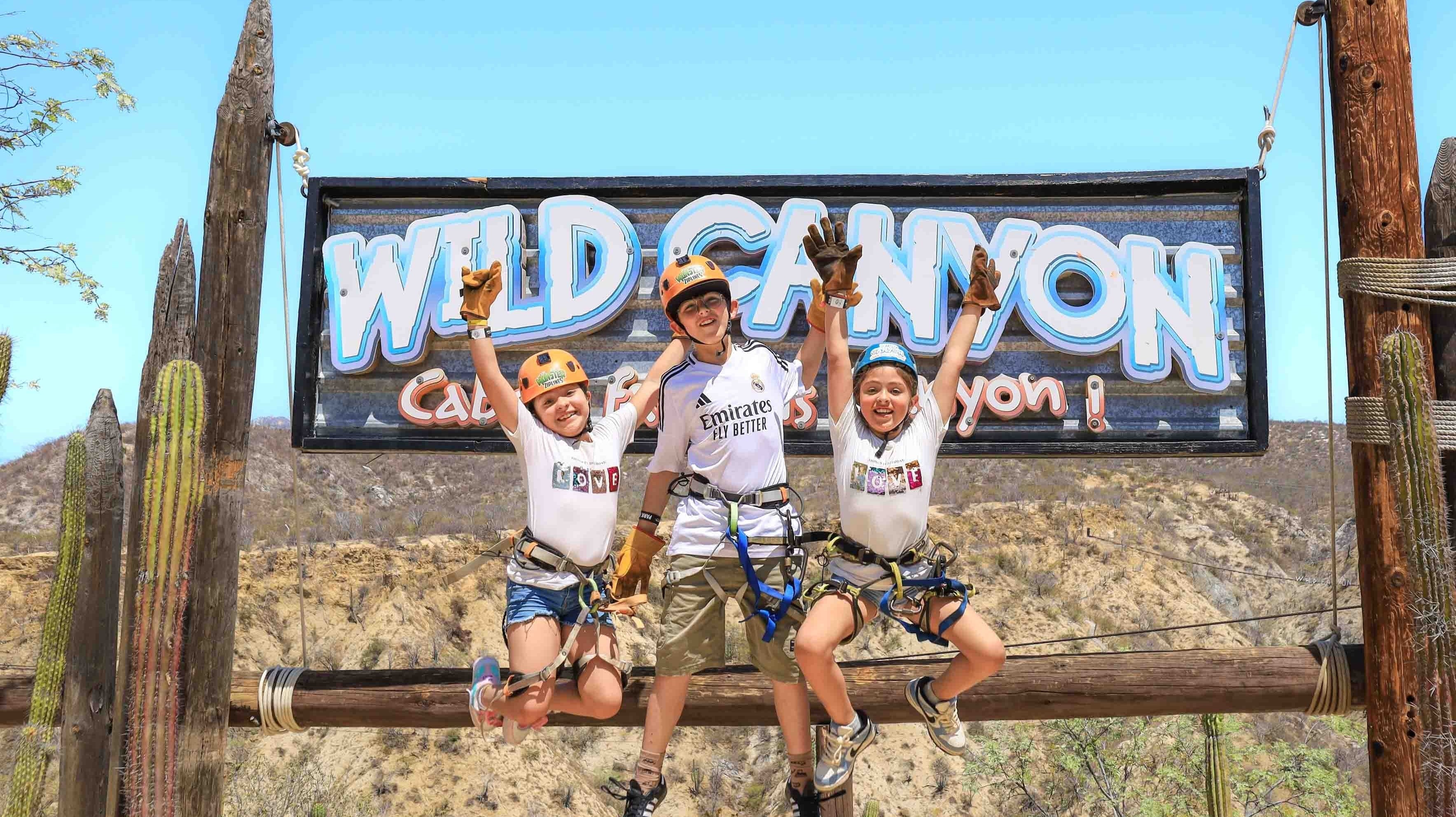 Family zipline adventure in Cabo with children and parents at Wild Canyon Adventures park