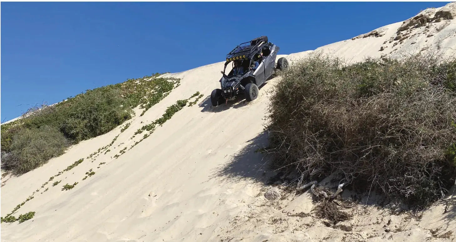 UTV climbing a coastal sand dune on the East Cape tour, Baja California Sur