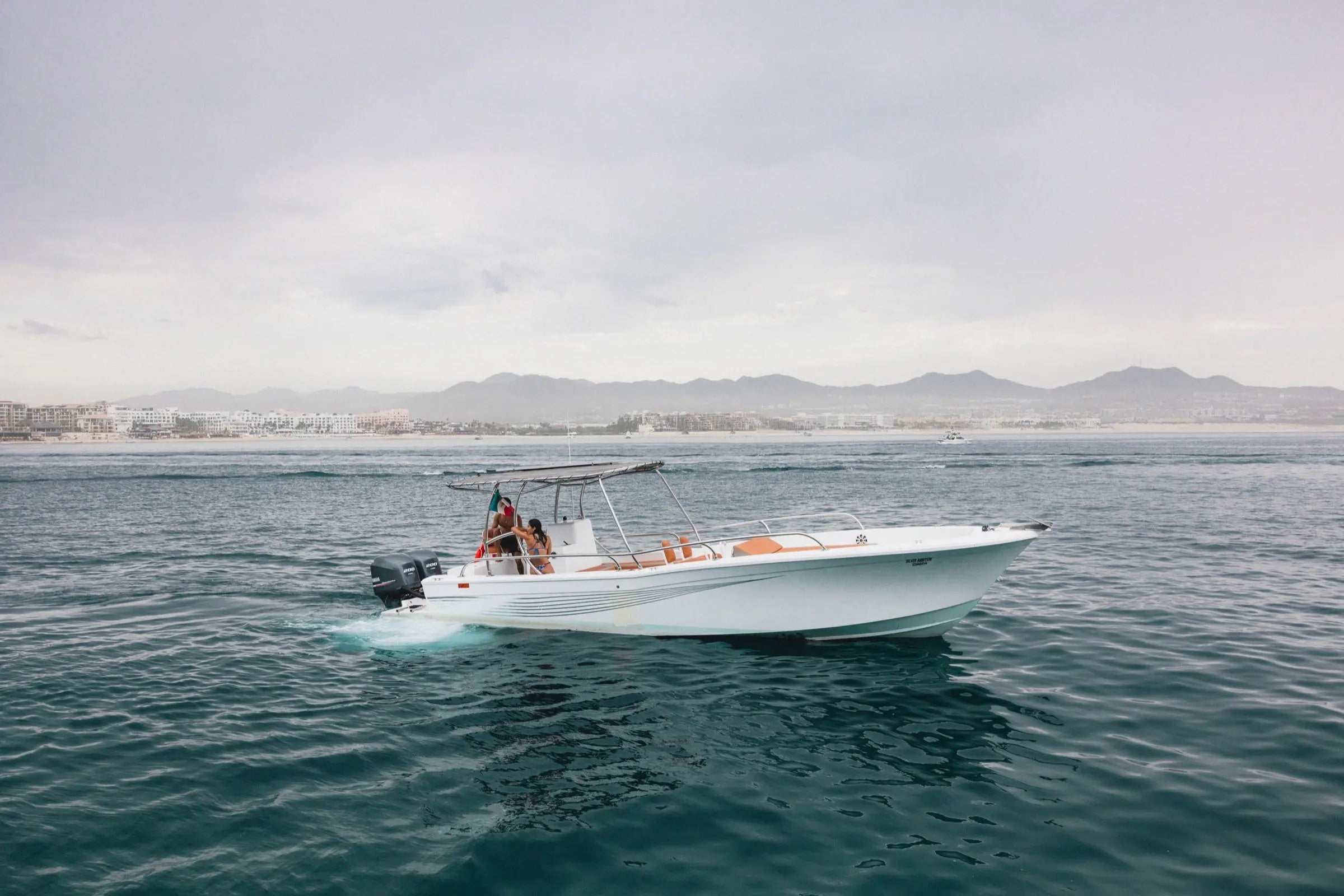 Pelican Cabo expedition boat cruising the Cabo San Lucas coastline