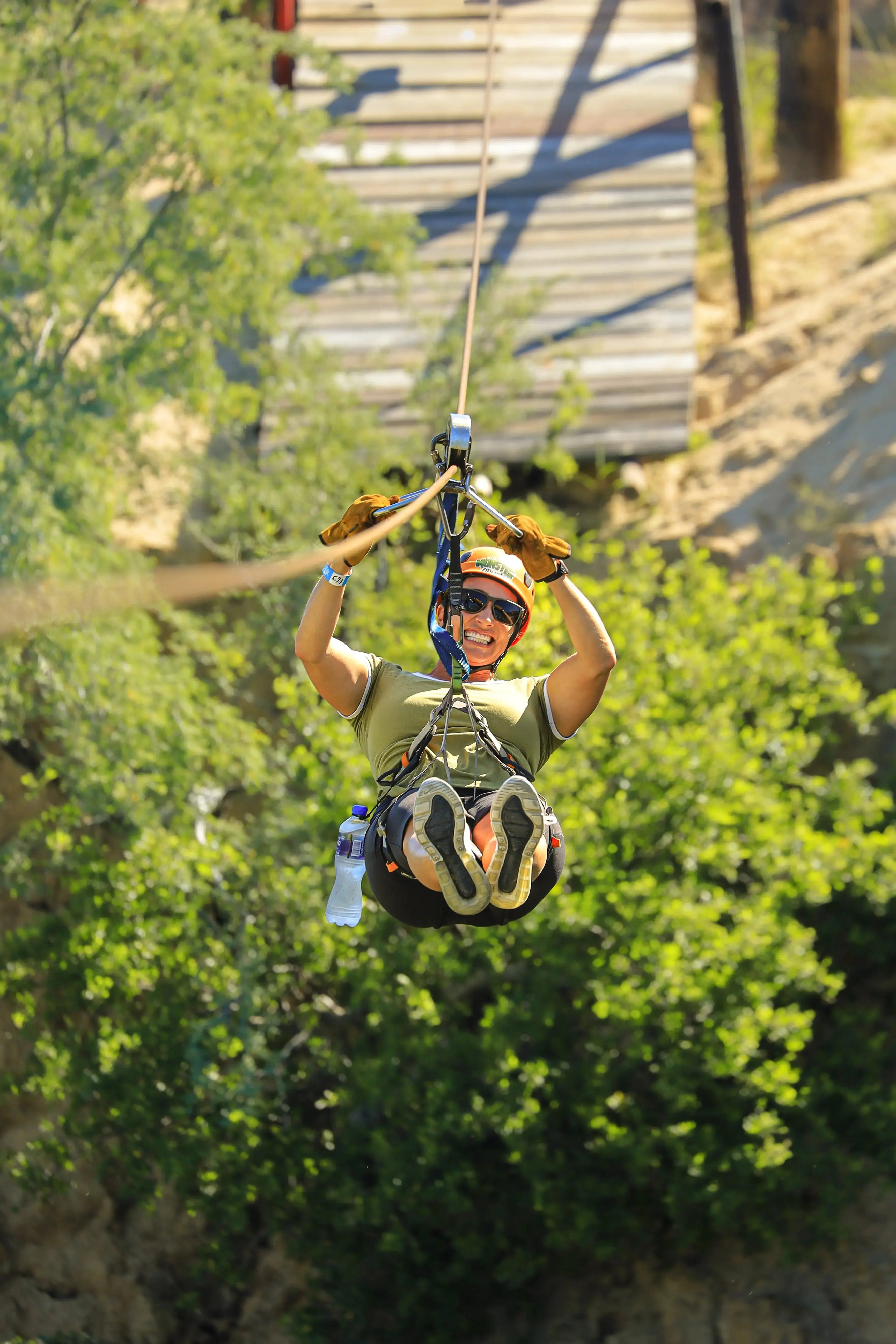 Guests ziplining over the canyon at Wild Canyon Adventures in Los Cabos