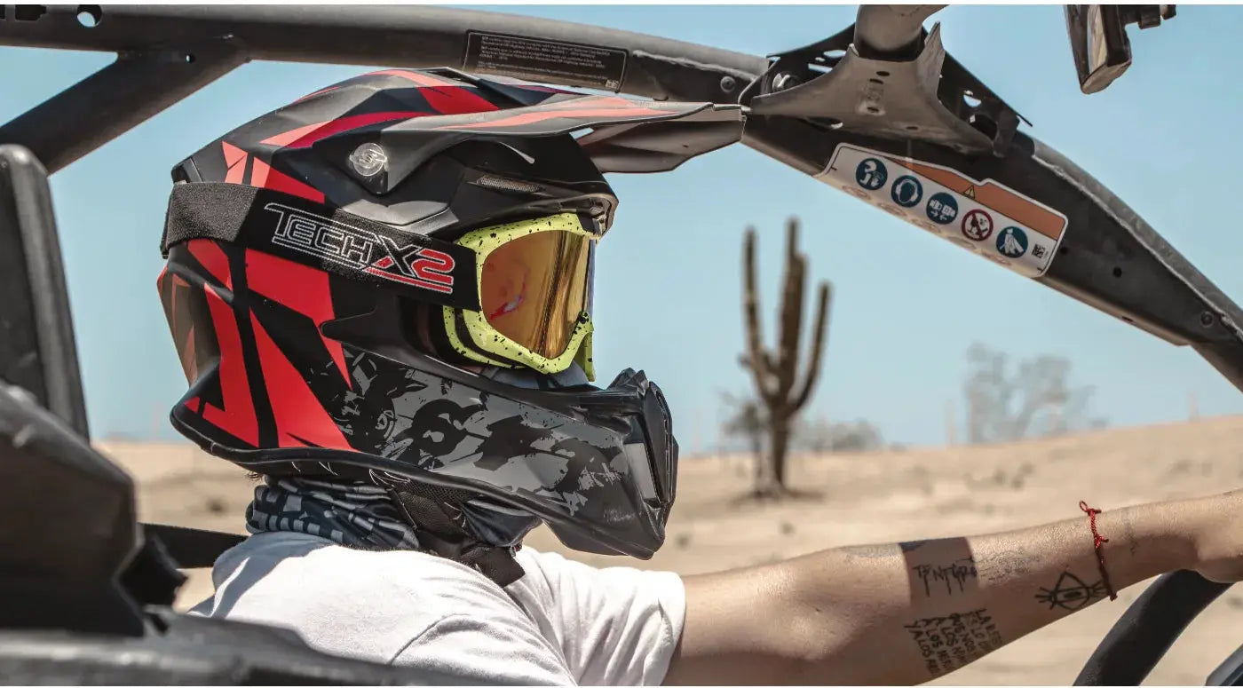 Rider in helmet and goggles on the East Cape UTV tour near Cabo San Lucas