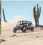 UTV kicking up dust past cardón cacti on the East Cape off-road tour, Los Cabos