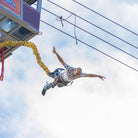 Man falling from suspended gondola in bungee jump