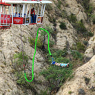 Woman falling from suspended gondola in bungee jump