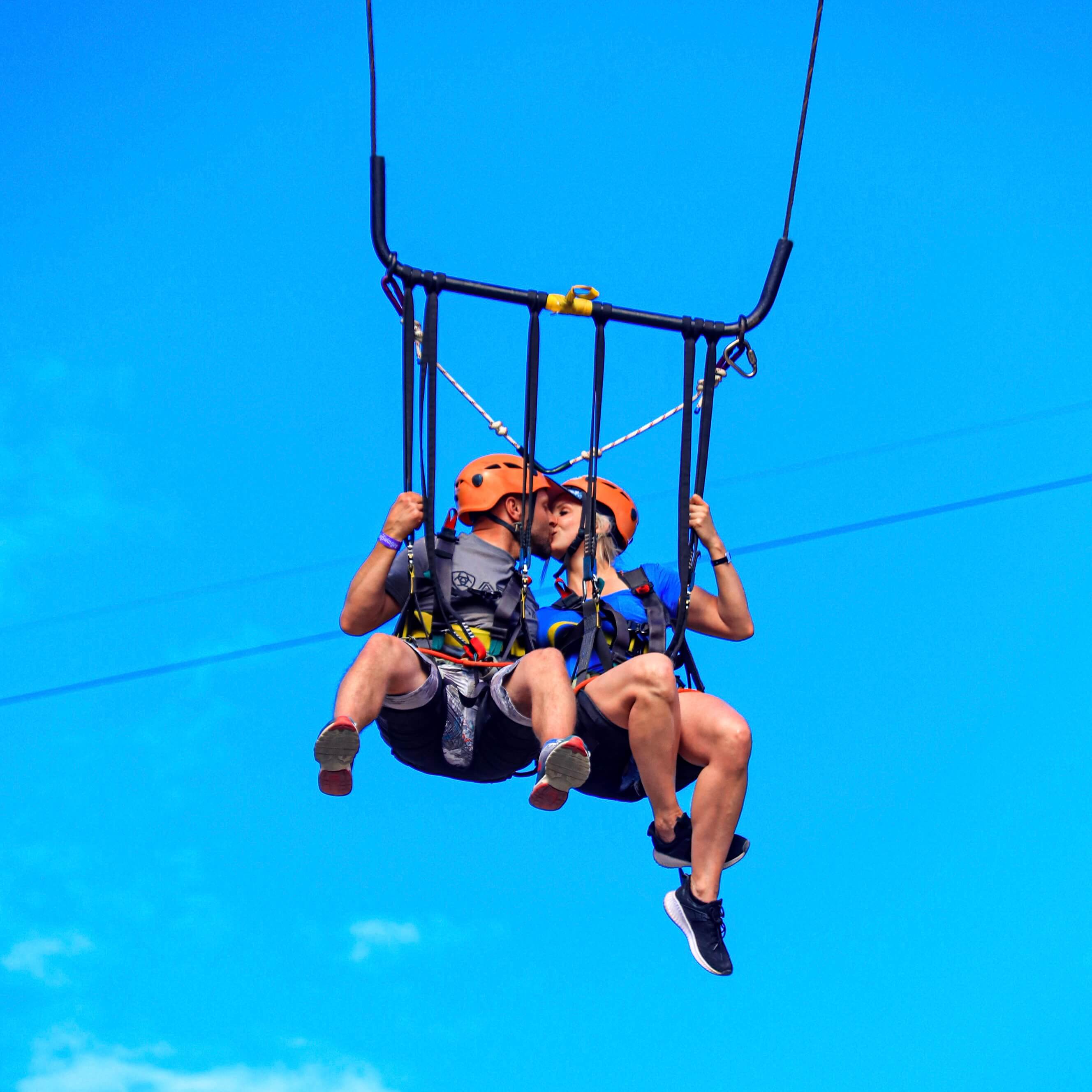 Couple kissing on Giant Swing