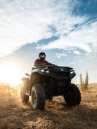 ATV rider on a Can-Am Outlander at golden hour in the Baja desert, Wild Canyon Adventures, Los Cabos