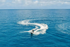 Aerial view of a Sea-Doo jet ski carving the deep blue sea off Los Cabos with Wild Canyon Adventures