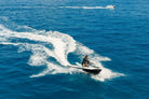Aerial view of Sea-Doo jet skis carving across the open sea off Los Cabos, Wild Canyon Adventures