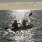 Couple on Kayak at sunset