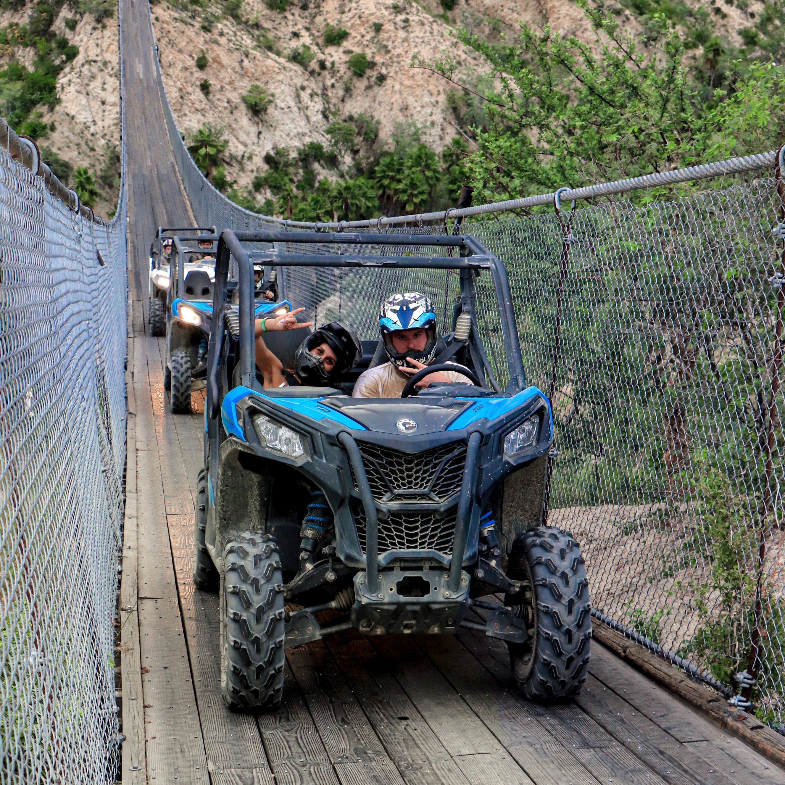 UTVs crossing hanging bridge - Wild Canyon Park Pass