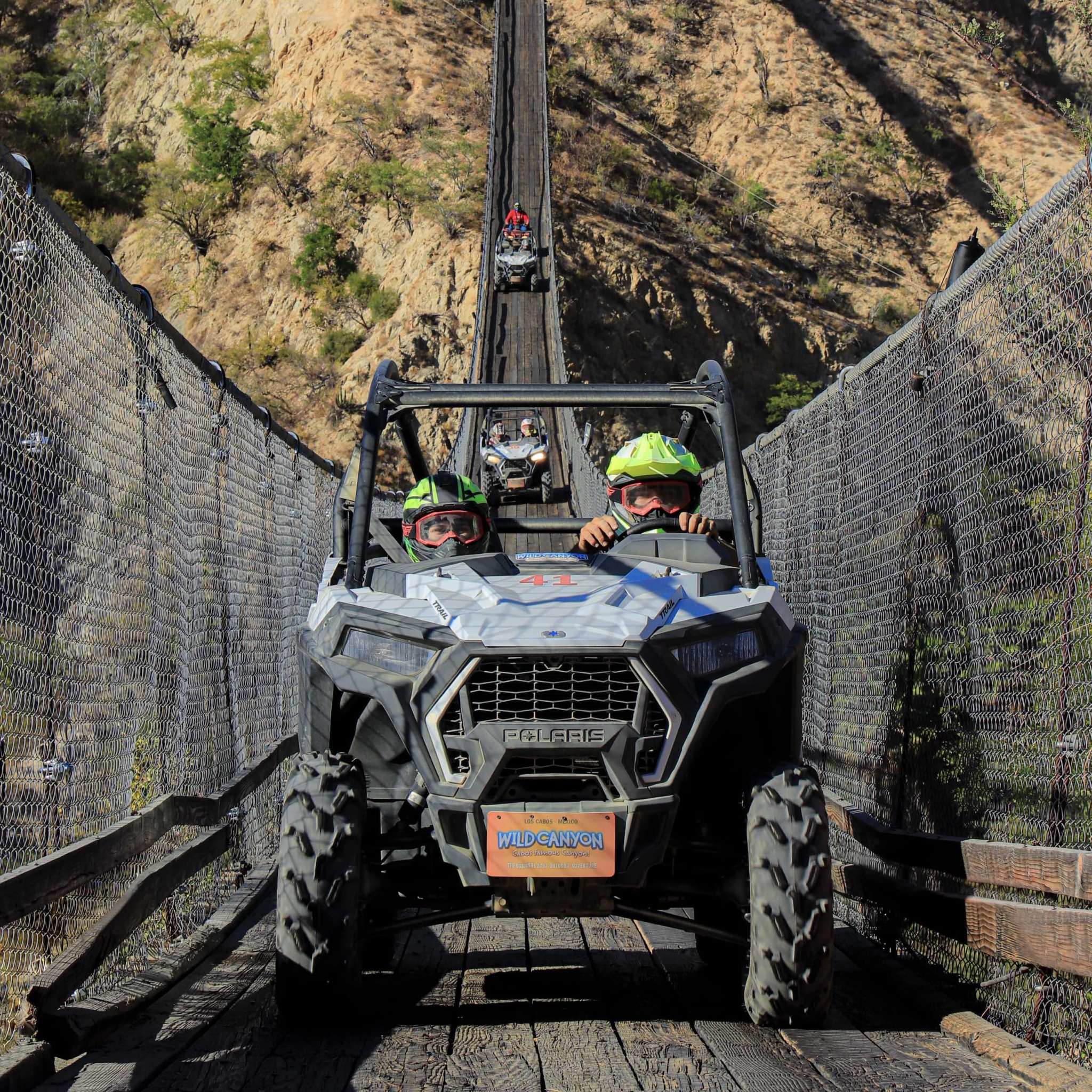 Razor crossing hanging bridge in Cabo - UTV Tour