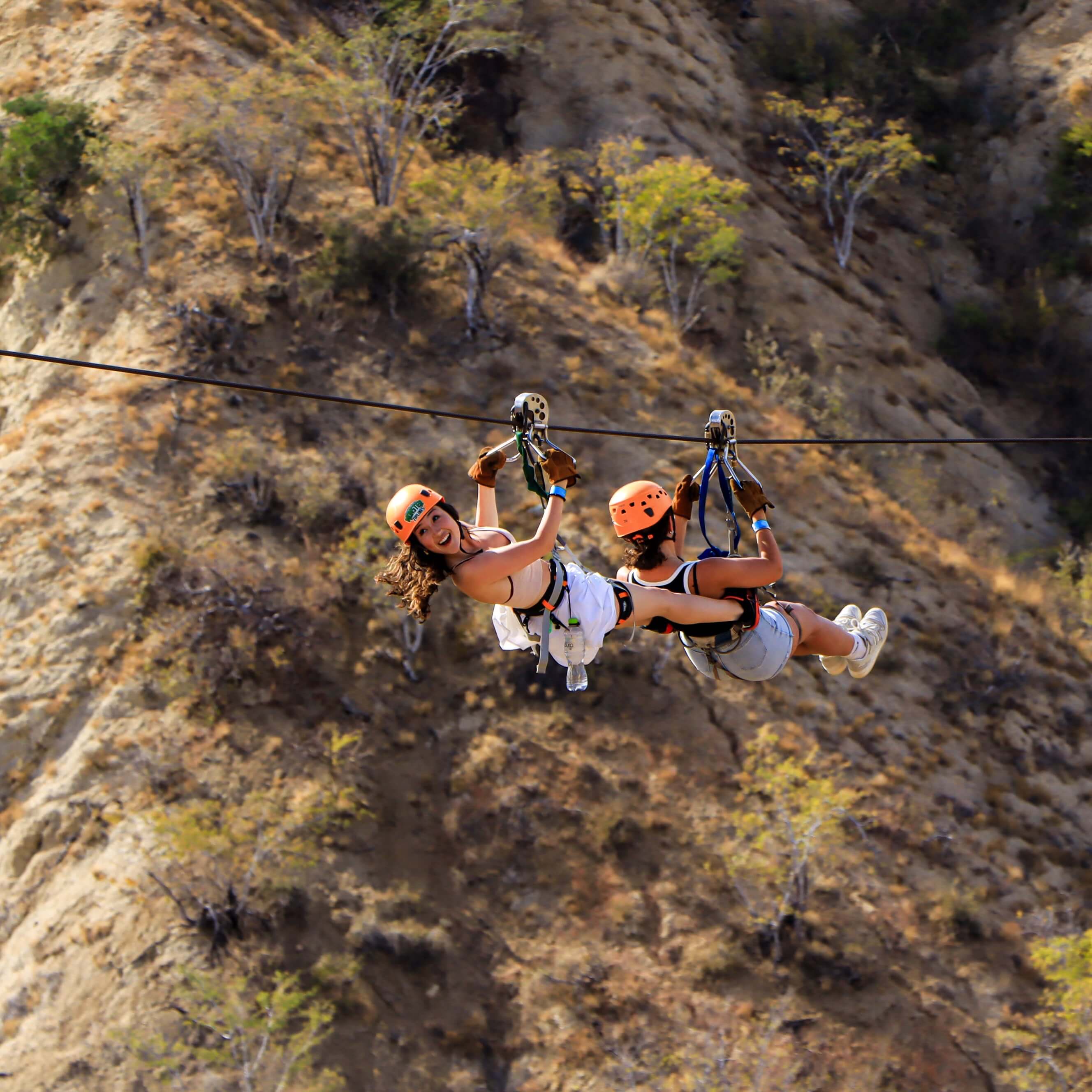 Girl on zipline - Wild Canyon Park Pas